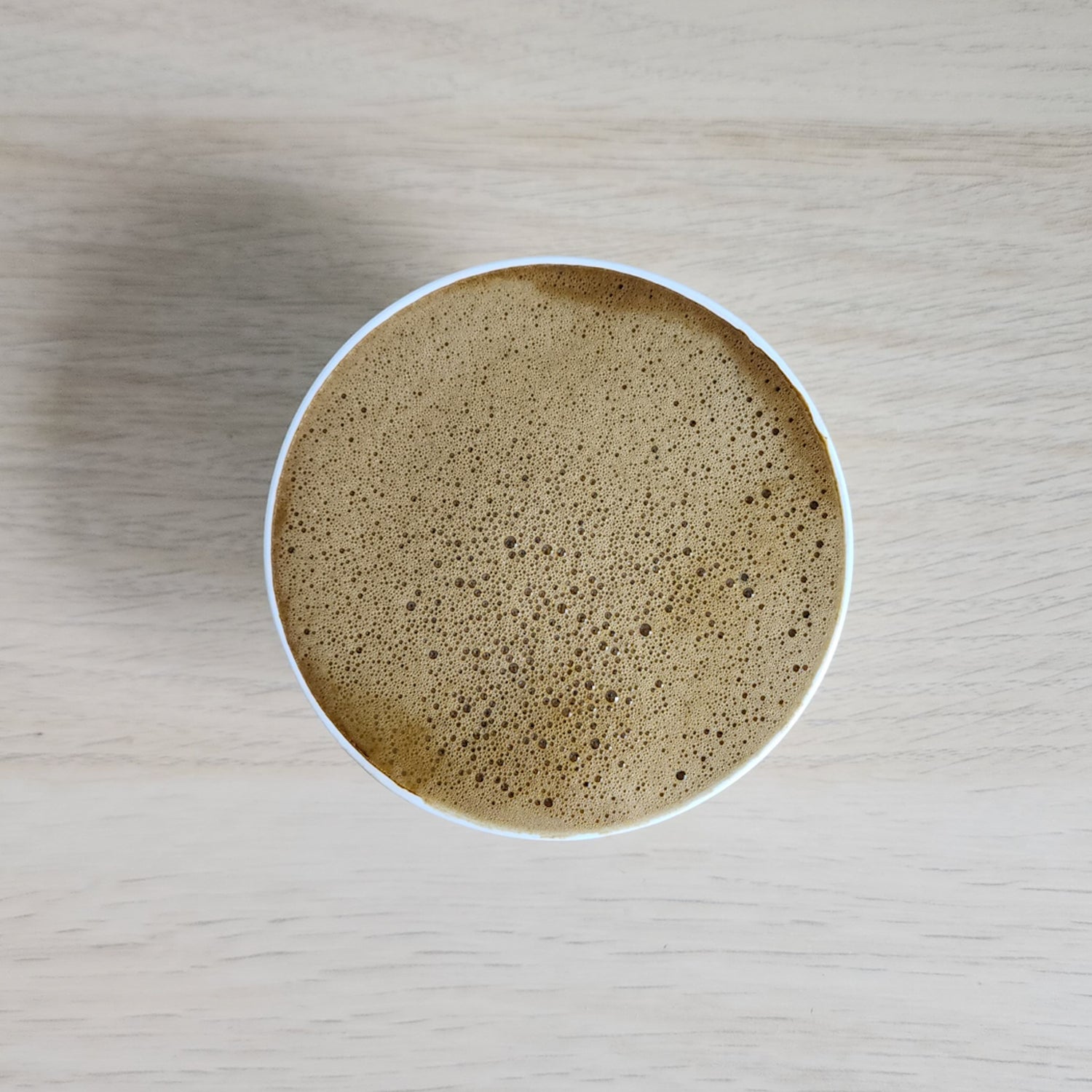 Velvety top of a Creamy and Foamy Hojicha Latte with premium Japanese tea powder for tea time with friends