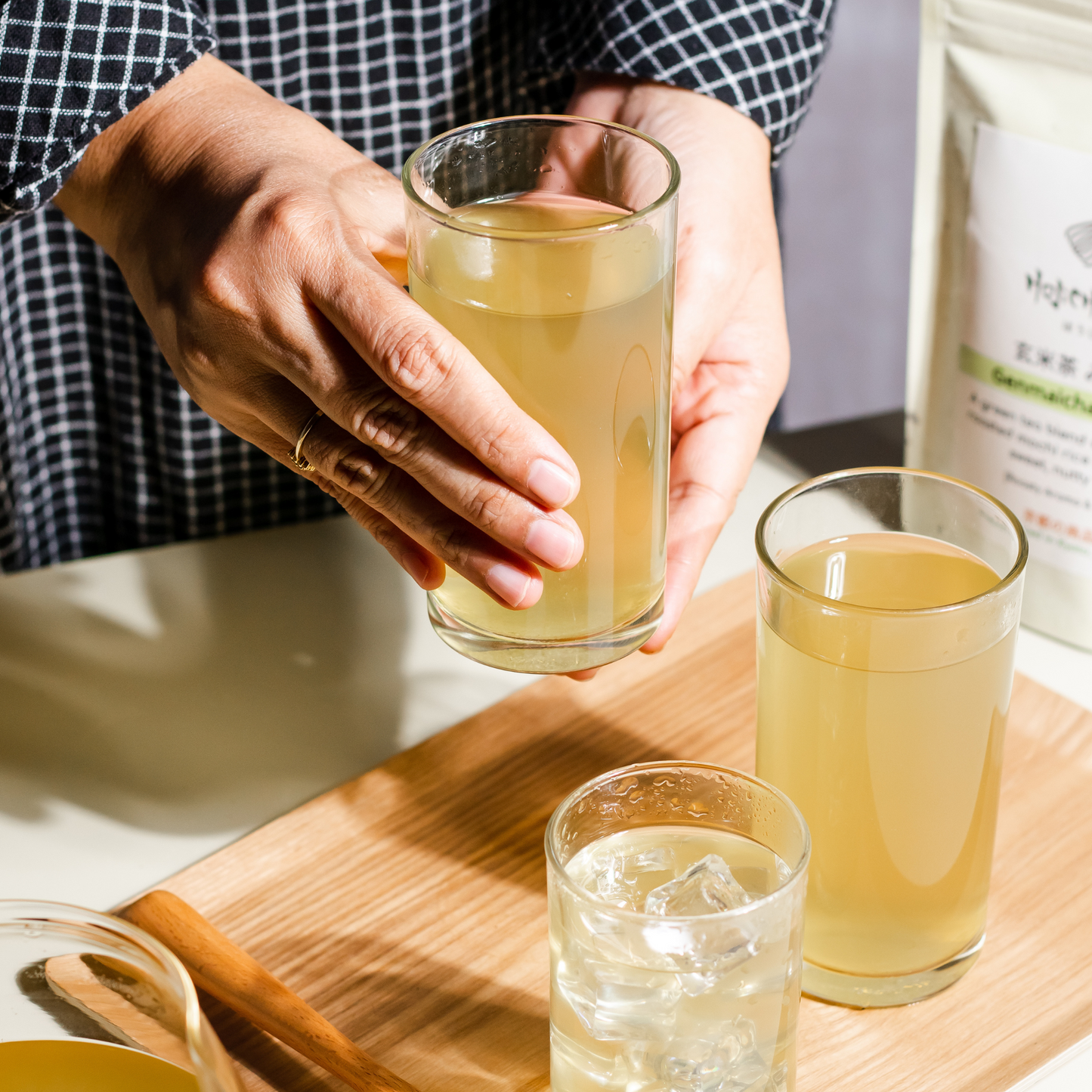 golden-hued refreshing Genmaicha tea brewed from Japanese green tea with roasted rice, served in a glass