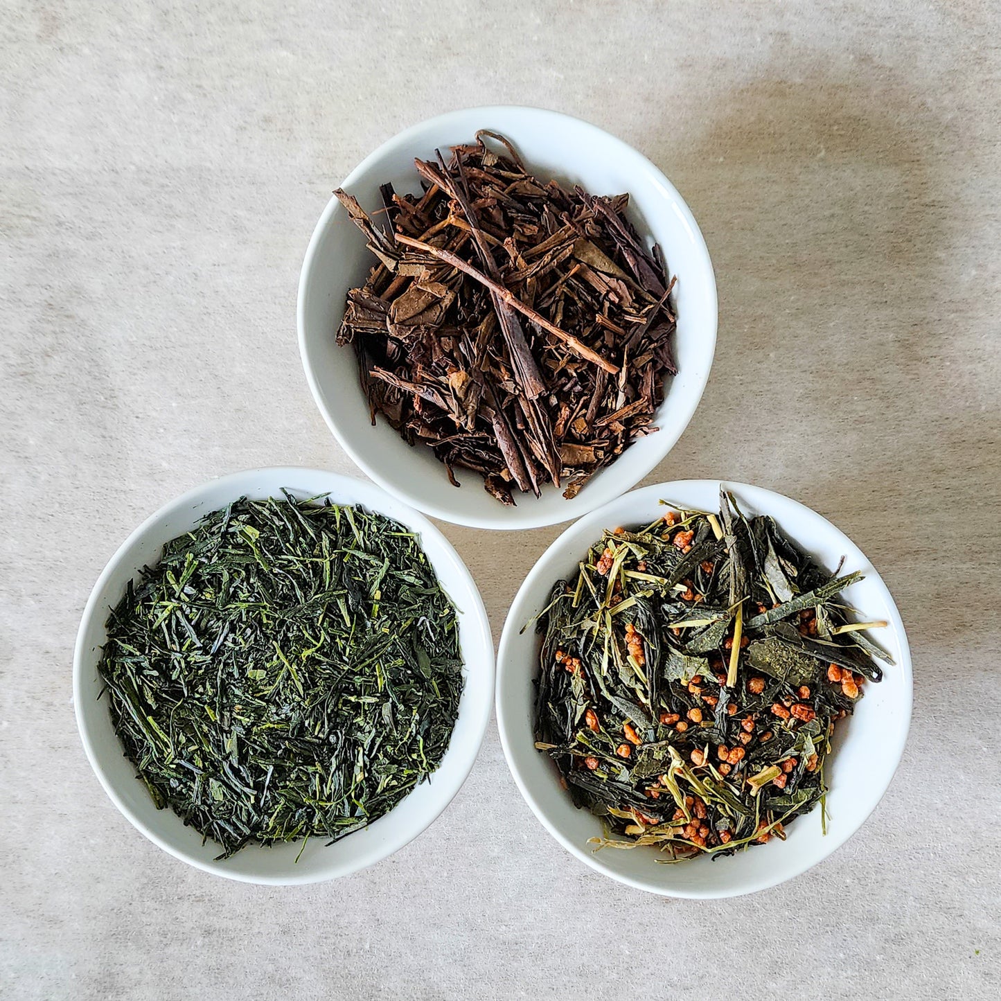 A trio of Japanese teas with Hojicha, Sencha, and Genmaicha, each offering unique flavors from roasted to grassy to nutty