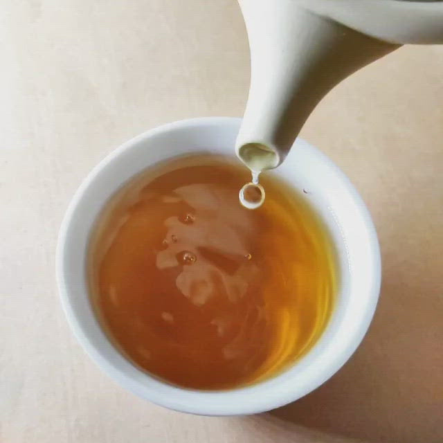 Premium Hoji-Genmaicha green tea brews into a golden and aromatic infusion