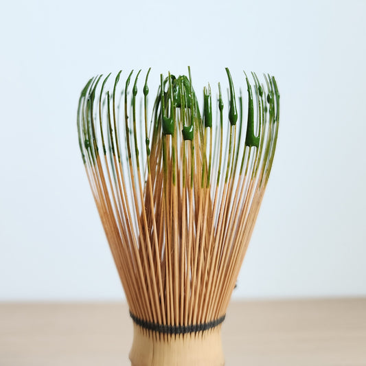 Smooth matcha essential of Traditional Japanese matcha bamboo whisk (chasen) with vibrant green matcha residue