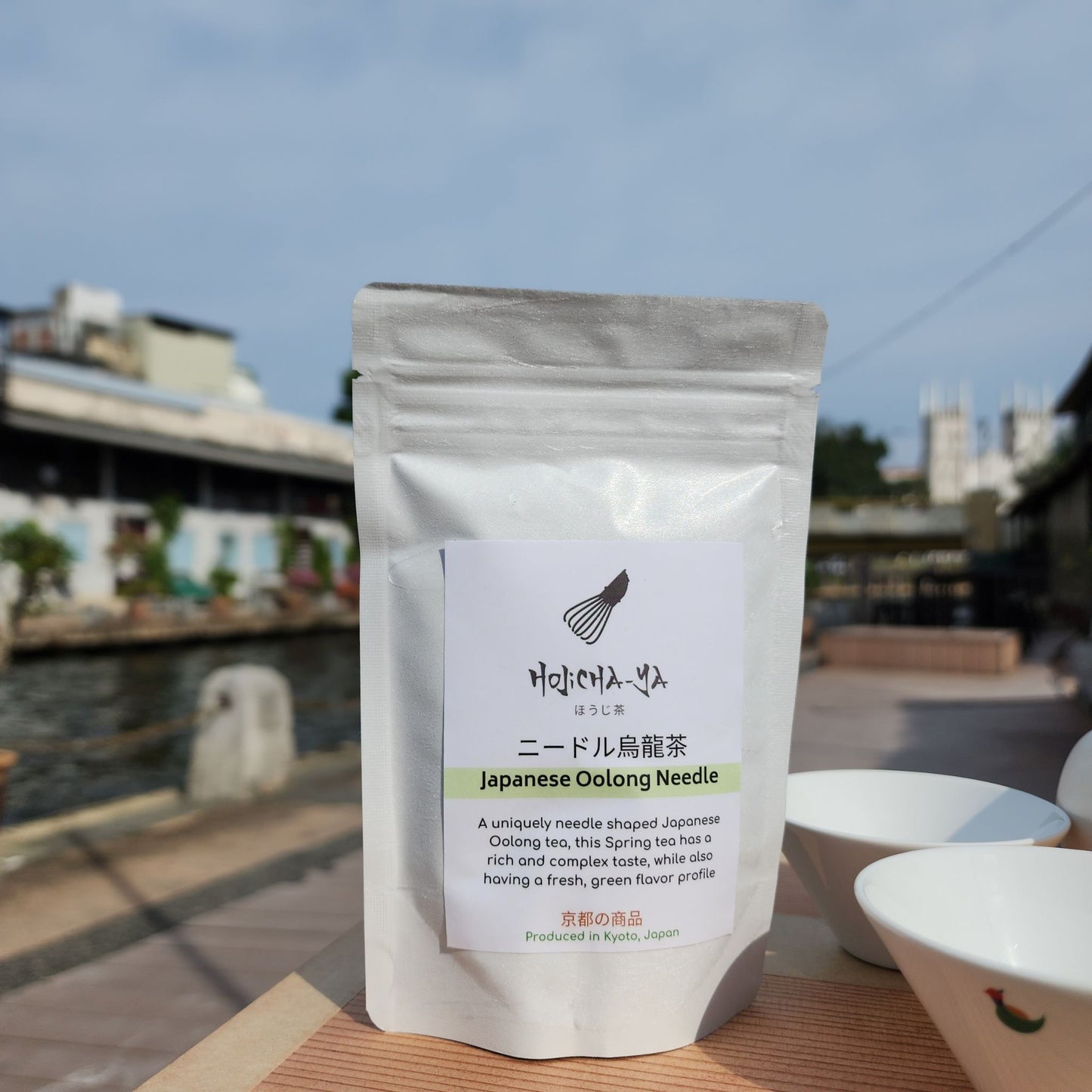 Authentic Japanese Oolong tea packaged for freshness, perfect for a relaxing tea session with a stunning outdoor view